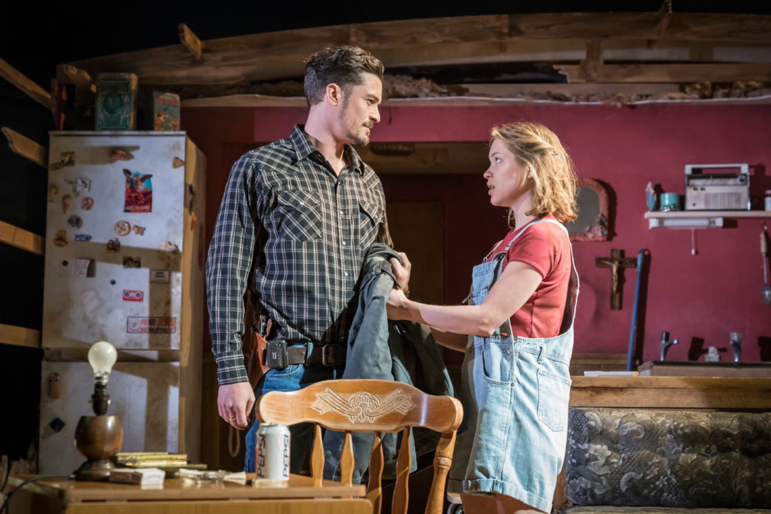 L-R: Orlando Bloom (Killer Joe Cooper) and Sophie Cookson (Dottie). Photo by Marc Brenner.