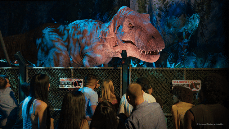 A T-Rex looms over the crowd at Jurassic World: The Experience, in Manchester