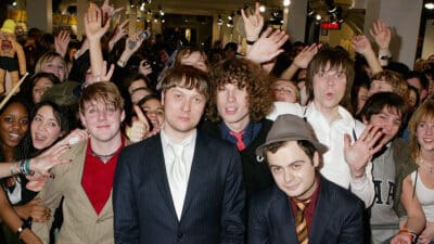 Ricky Wilson, Andrew White, Simon Rix, Peanut and Nick Hodgson of Kaiser Chiefs sign copies of their debut album, Employment, at HMV on March 7, 2005 in London.