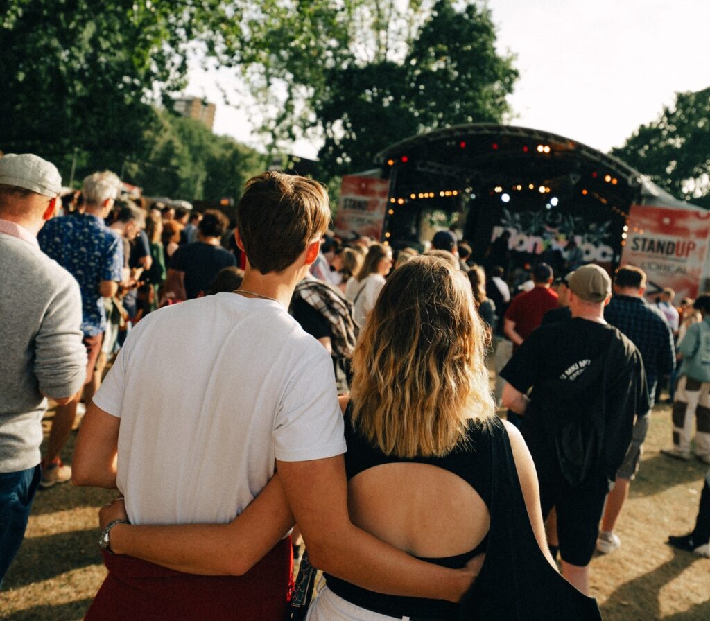 A couple arm in arm at All Points East festival.