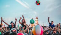 Festival fans sing and throw beach balls during Declan McKenna's performance on day three of Y Not Festival 2024 Pikehall on August 03, 2024