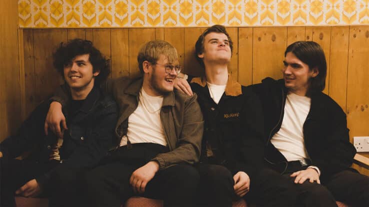 The Lathums, sitting on a sofa