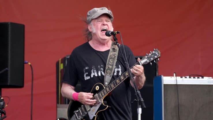 Neil Young performing in 2024