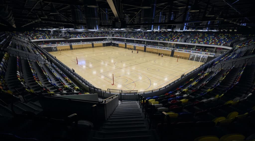 The inside of Copper Box Arena with the court set up for a game and the seating empty