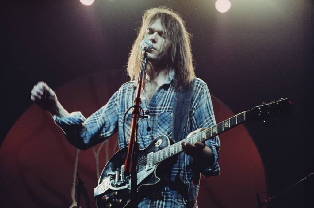 Neil Young performing at London's Hammersmith Odeon in 1976
