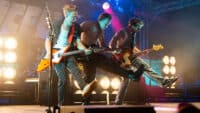 Tom Fletcher, Danny Jones and Dougie Poynter of McFly performing on stage at Download Festival