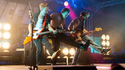 Tom Fletcher, Danny Jones and Dougie Poynter of McFly performing on stage at Download Festival