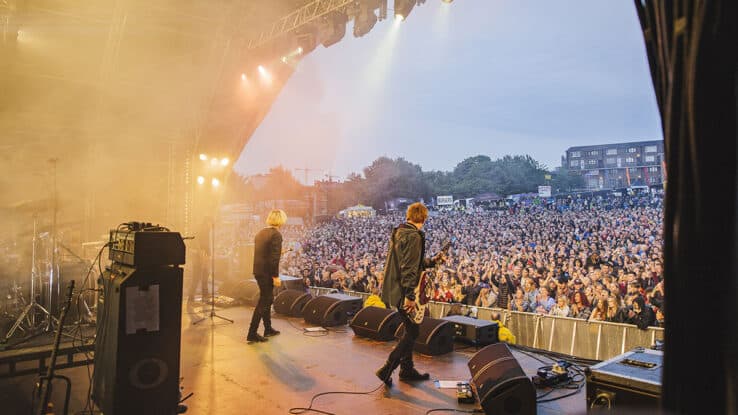 View from the side of the stage as The Charlatans perform at Tramlines Festival in Sheffield, 2015.
