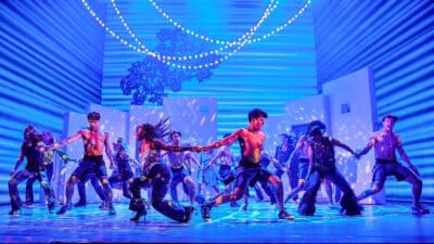 Dancers onstage in the West End production of Mamma Mia!