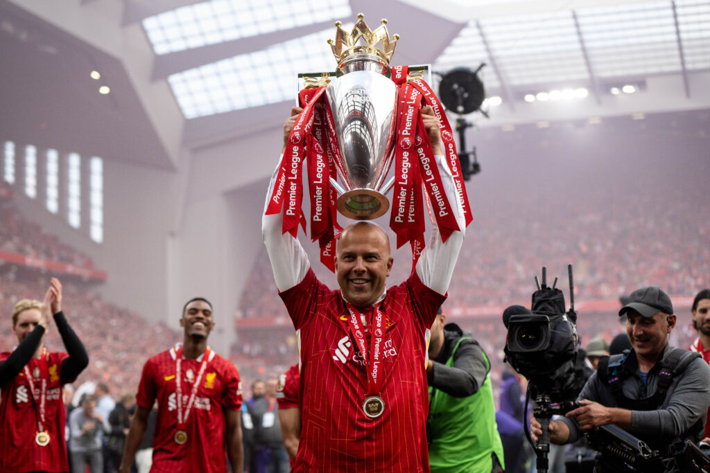 LIVERPOOL, ENGLAND - MAY 25: manager Arne Slot celebrates with a trophy as Liverpool are crowned the Champions of the Premier League for the 2024/25 Season, following the Premier League match between Liverpool FC and Crystal Palace FC at Anfield on May 25, 2025 in Liverpool, England. (Photo by Sebastian Frej/Getty Images)