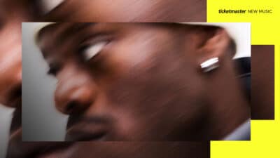 A blurry, close-up image of V.I.C inside a Ticketmaster New Music branded template