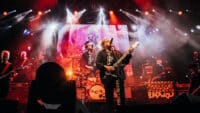 The Cure perform on stage