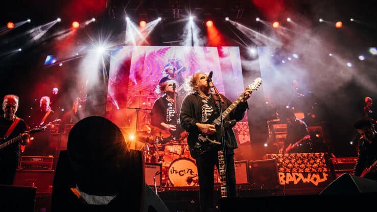 The Cure perform on stage