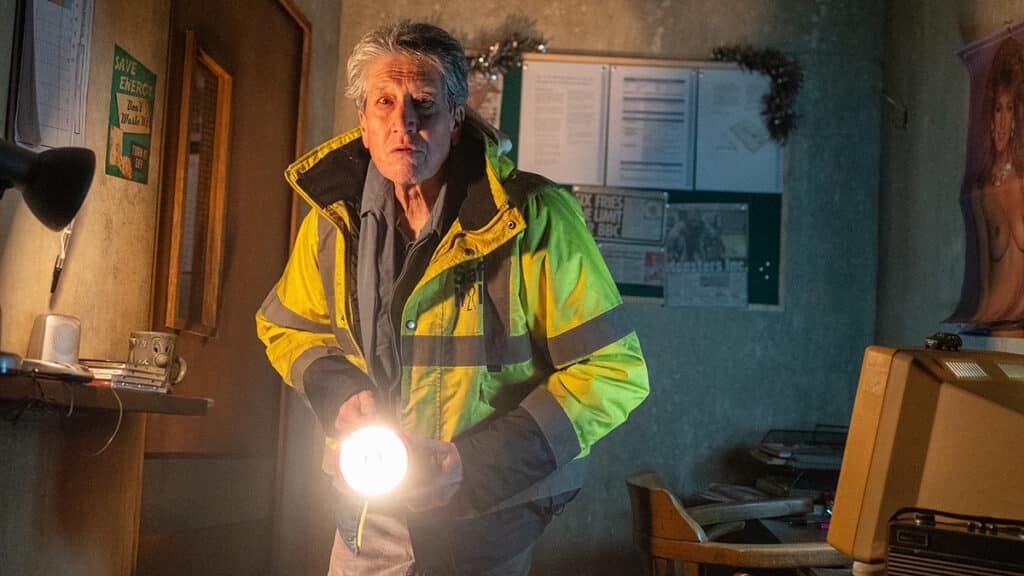 David Cardy in Ghost Stories, holding a torch