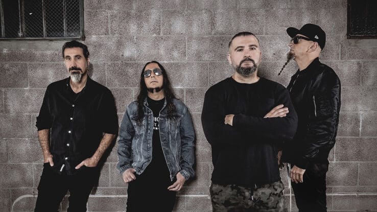 System Of A Down leaning against a wall