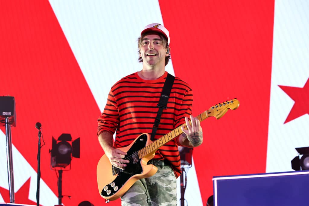 Alex Gaskarth of All Time Low performing live on stage