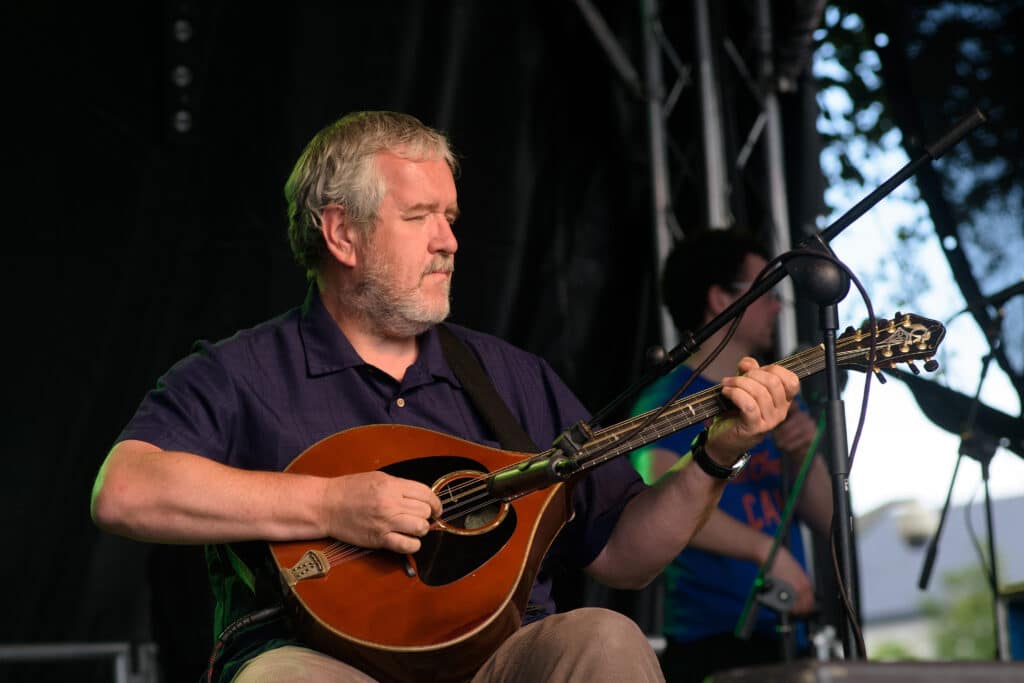 Michael Holmes of Dervish performs on stage