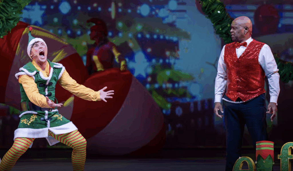 Actors onstage during a live performance of Elf the Musical