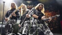Thobbe Englund, Pär Sundström and Chris Rörland of Sabaton performing on stage