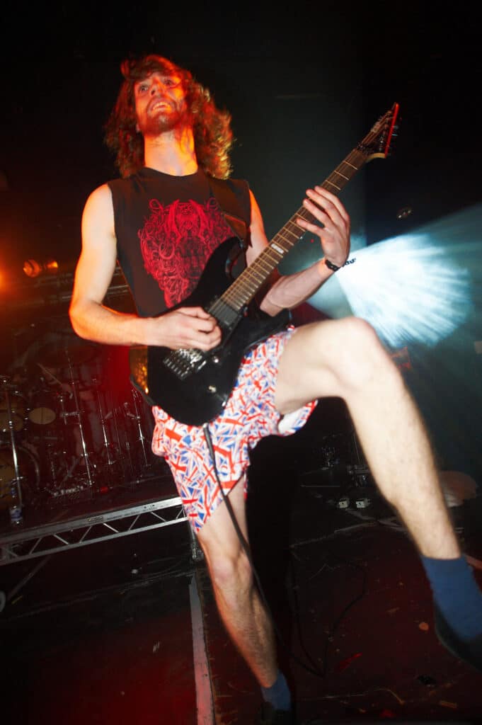 Josh Middleton of Sylosis performing on stage in 2009