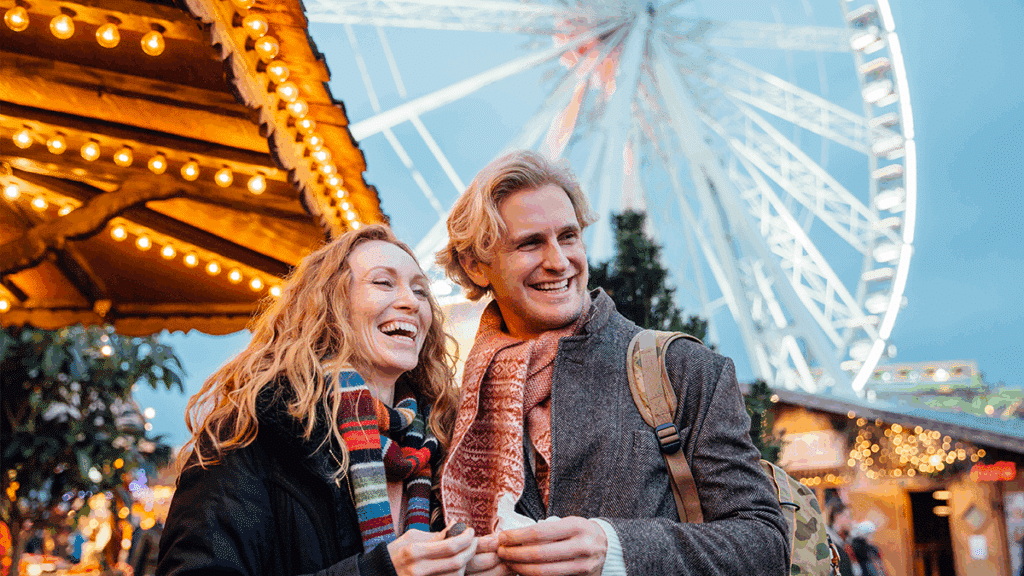 A happy couple at a Christmas market in London