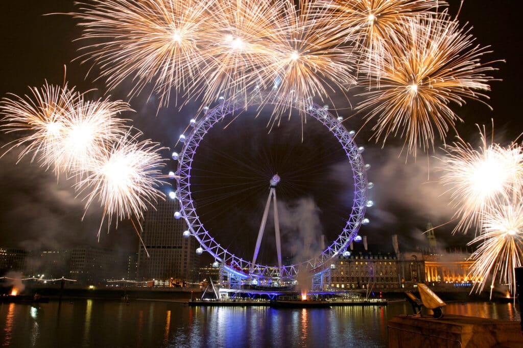 Fireworks exploding over The London Eye at night