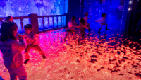 Children playing in the Coco display at Mundo Pixar Experience