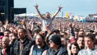 Festival goers cheering in the crowd Download Festival