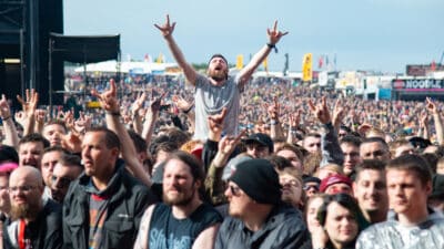 Festival goers cheering in the crowd Download Festival
