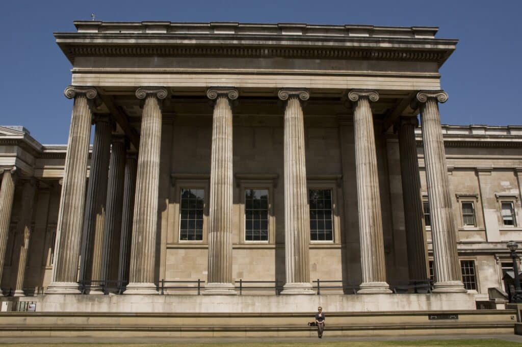 A lone visitor to the British Museum standing outside the entrance