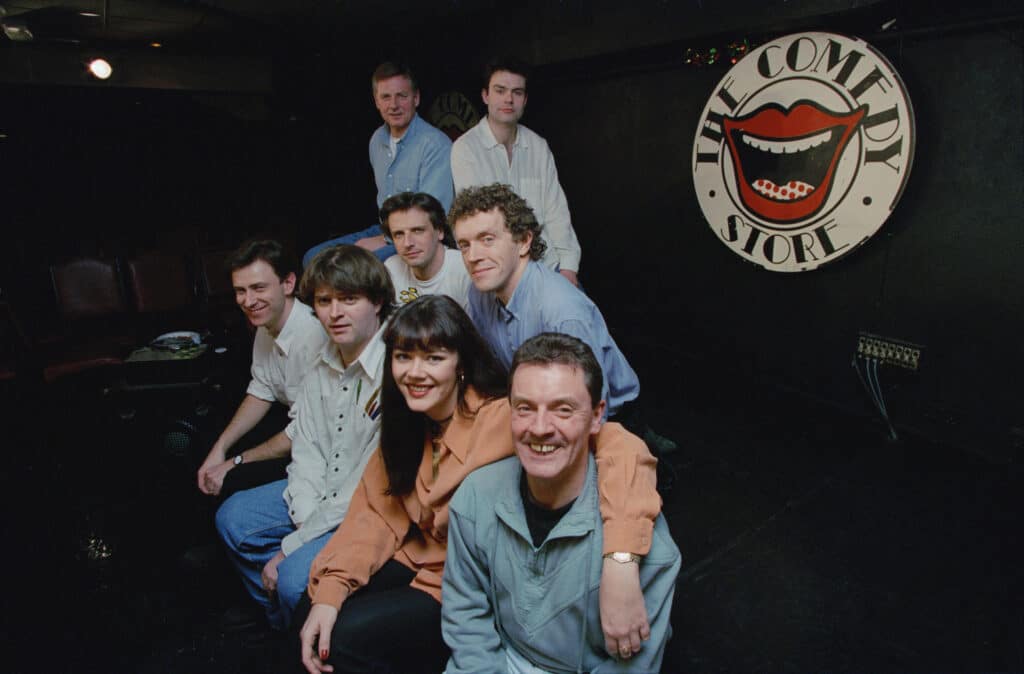 Paul Merton, Josie Lawrence, Richard Vranch, Andy Smart, Neil Mullarkey, Jim Sweeney posing in The Comedy Store comedy club