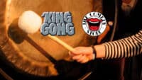 King Gong at The Comedy Store, showing a hand hitting a gong