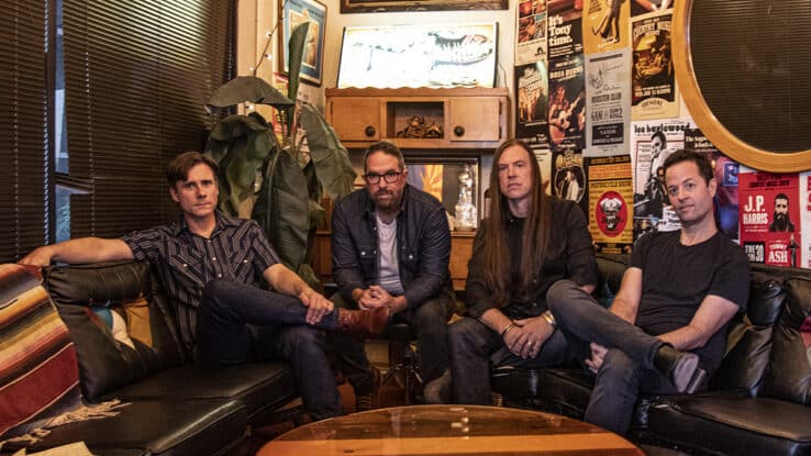 Jimmy Eat World sat around a table