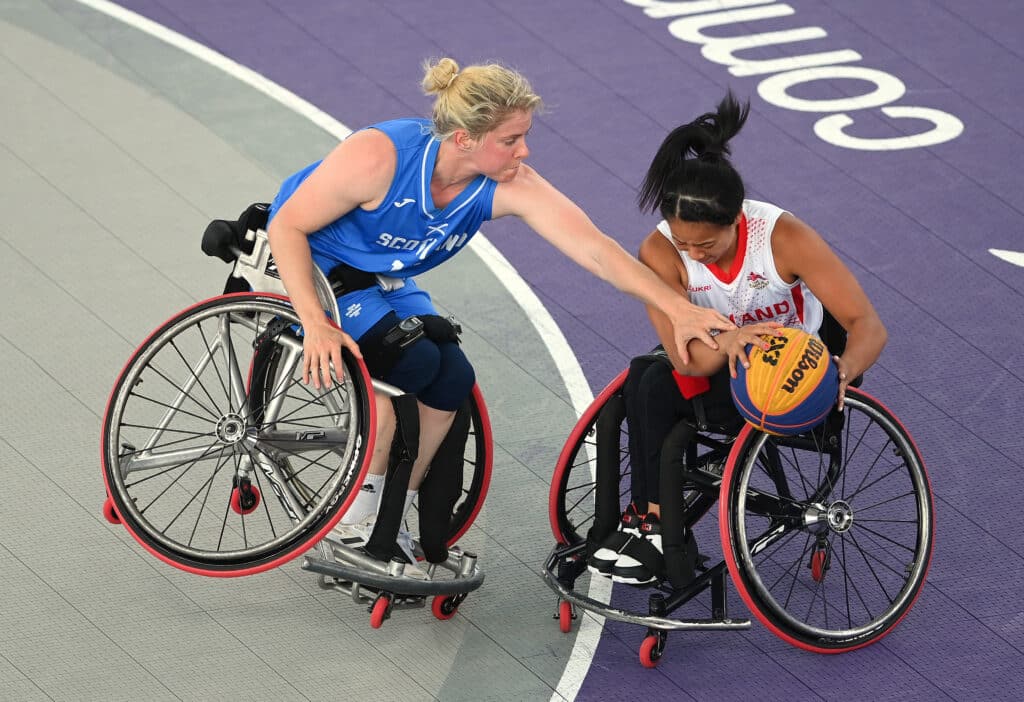 oy Haizelden #14 of Team England battles for the ball against Robyn Love #13 of Team Scotland during the Women's Wheelchair 3x3 Basketball Bronze Medal match on day five of the Birmingham 2022 Commonwealth Games at Smithfield on August 02, 2022 on the Birmingham, England.