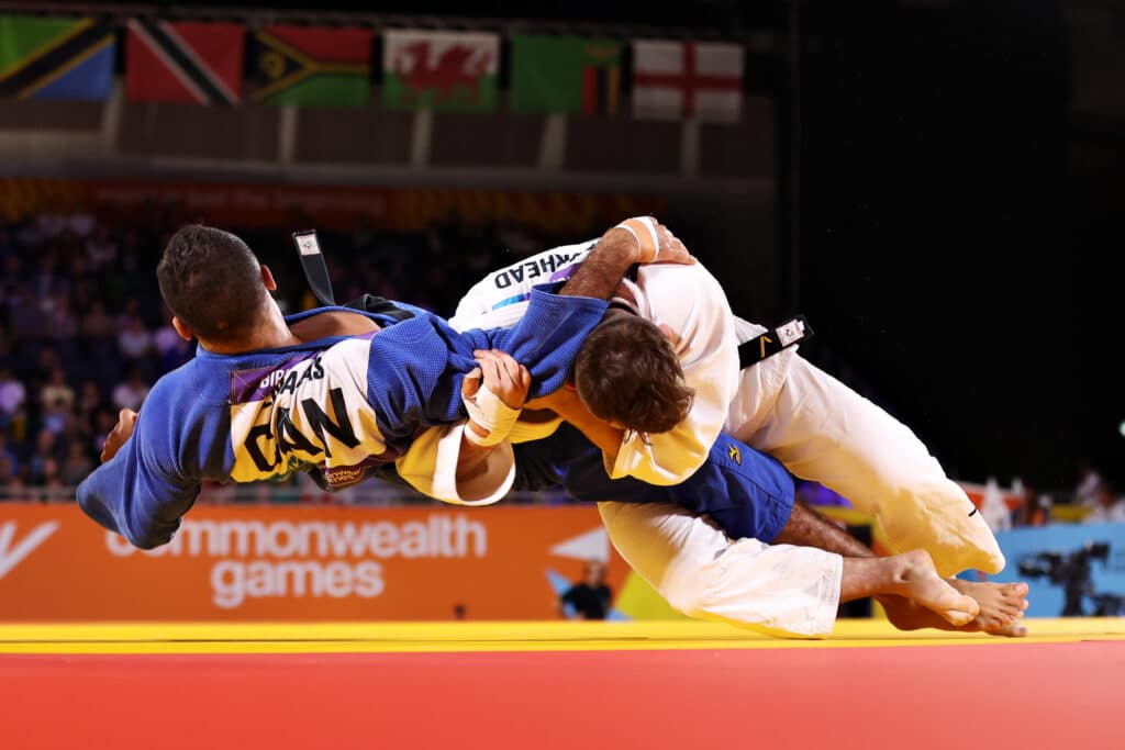 Lachlan Moorhead of Team England (White) competes against Mohab Elnahas of Team Canada (Blue) during their Judo Men's -81kg Semi-Final match on day five of the Birmingham 2022 Commonwealth Games at Coventry Stadium on August 02, 2022 in Coventry, England.