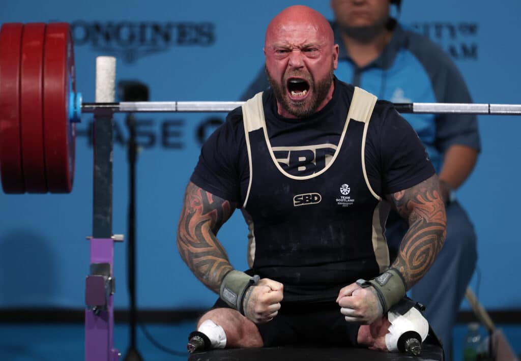 Micky Yule of Team Scotland celebrates a lift during the Men's Para Powerlifting Heavyweight Final on day seven of the Birmingham 2022 Commonwealth Games at NEC Arena on August 04, 2022 in Birmingham, England. (