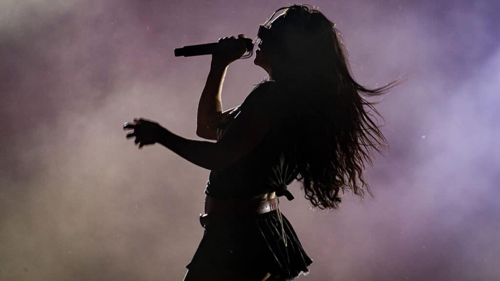 Charli XCX performs on stage