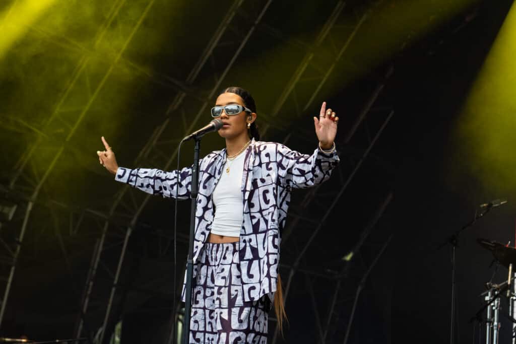 Olivia Dean performing live on stage