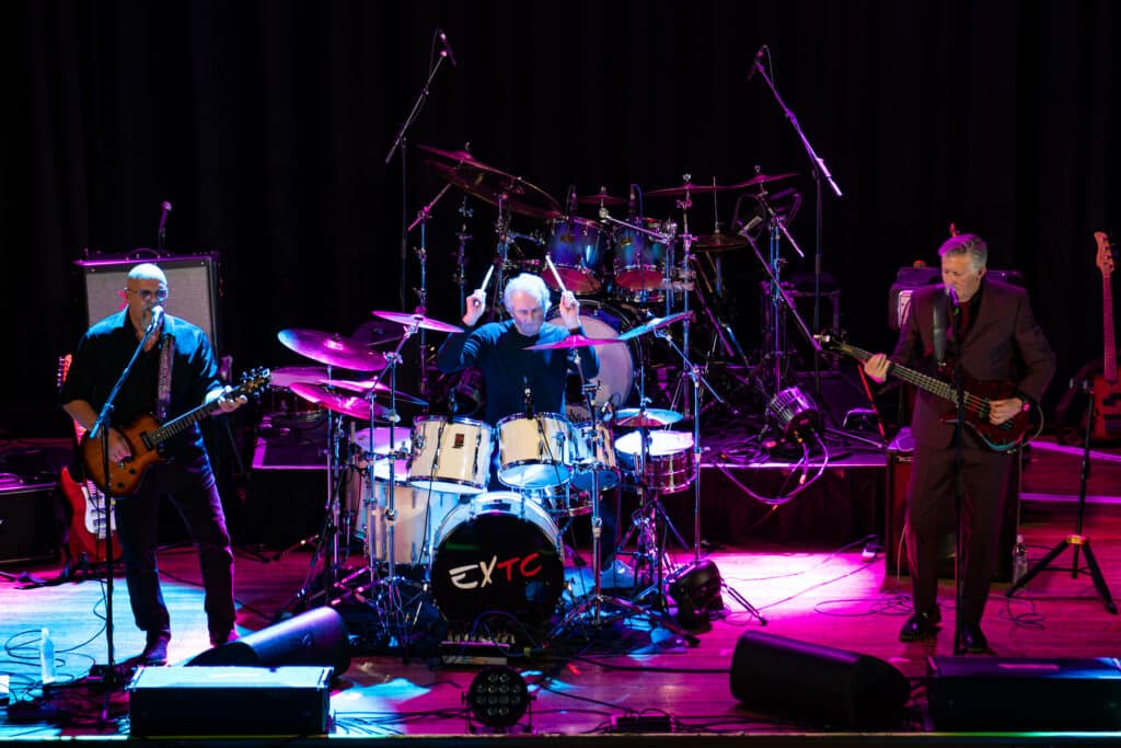 Steve Hampton, Terry Chambers and Terry Lines of EXTC performing live onstage