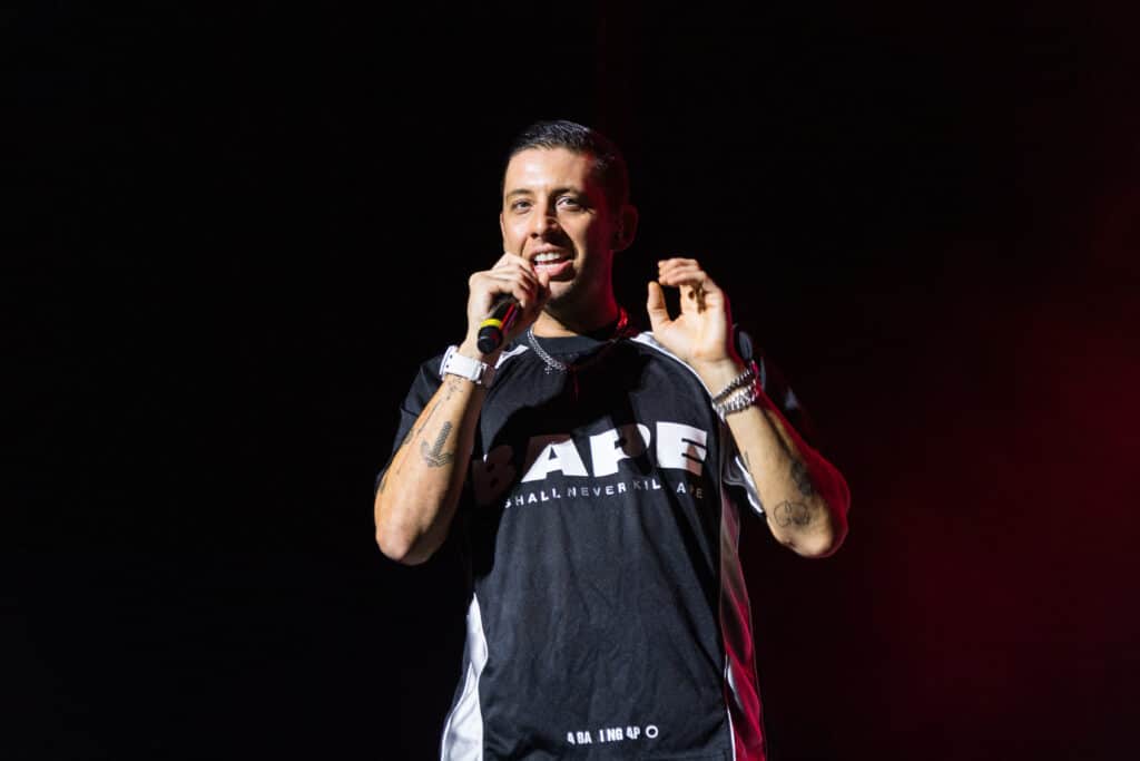 Example performing live onstage