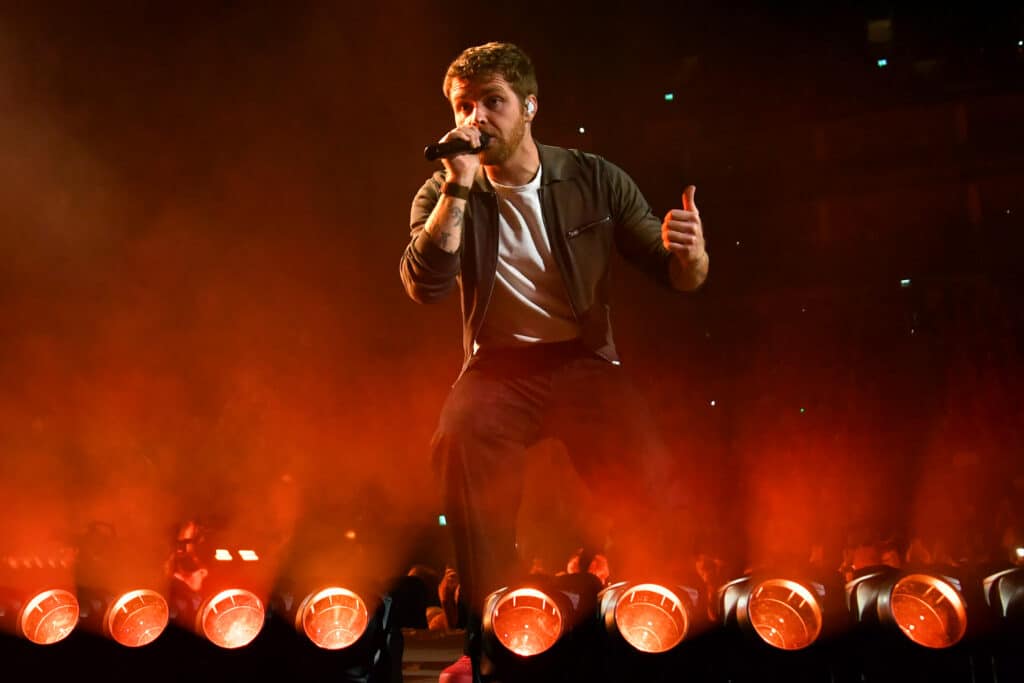 Alex Warren performing live onstage