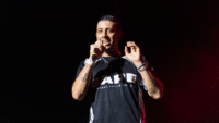 Example performing live onstage