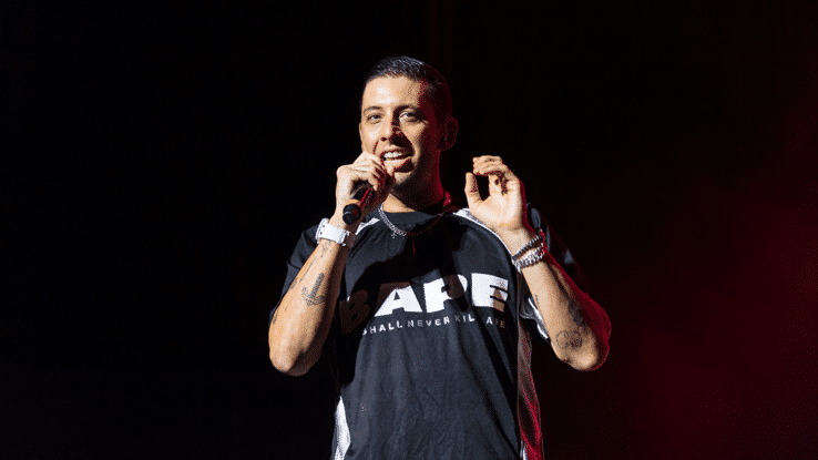 Example performing live onstage