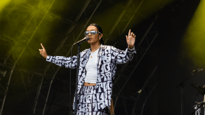 Olivia Dean performing live on stage