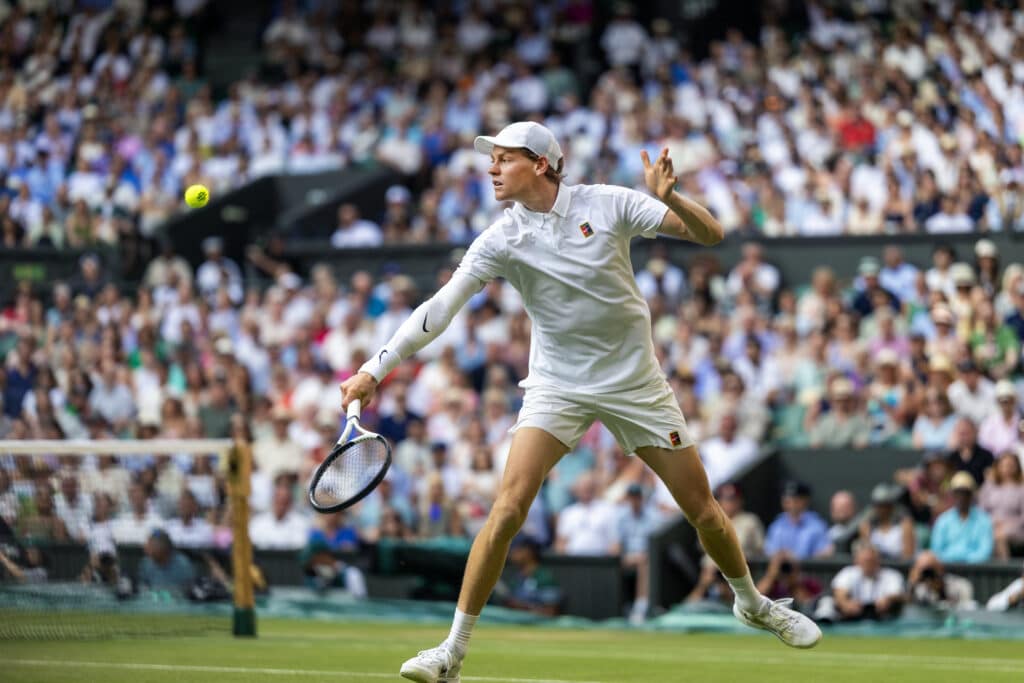 Jannik Sinner playing tennis at Wimbledon