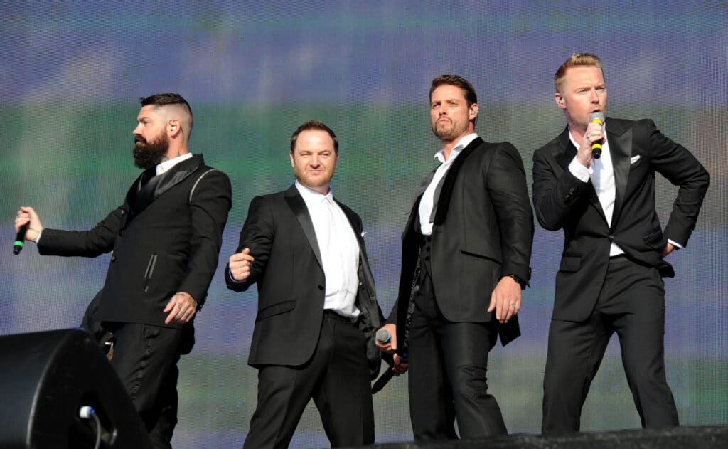 Boyzone performing live on stage