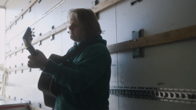 Lewis Capaldi plays the guitar backstage