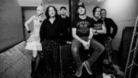 The Wonder Stuff sitting on a stack of amps