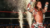 Shawn Michaels celebrates in front of a stream of fireworks at One Night Only in Birmingham in 1997