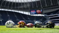 Four American football helmets and an American football in Tottenham Hotspur stadium